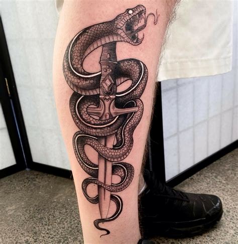 snake tattoos for men|snake wrapped around leg tattoo.